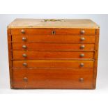 A six-drawer chest of vintage dentist's instruments 25 cm h x 34 cm w x 23 cm