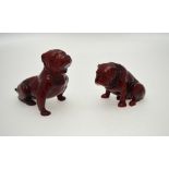 Two Royal Doulton flambe ware models of bulldogs, one by Noke, 6.5 cm high and 9.5 cm high (2)