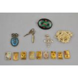 A collection of antique jewellery items including gilt metal white paste set Victorian cross, cut