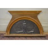 An antique pre-raphaelite style cast iron panel of arch form depicting a lady with peacocks in a
