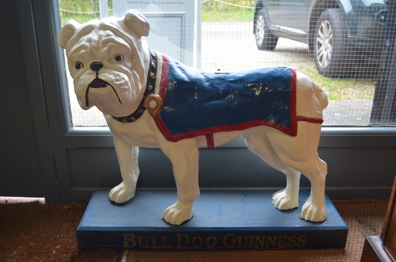 A large vintage cast iron 'Bull-Dog Guinness' advertising figure, the eyes fitted with bulbs,