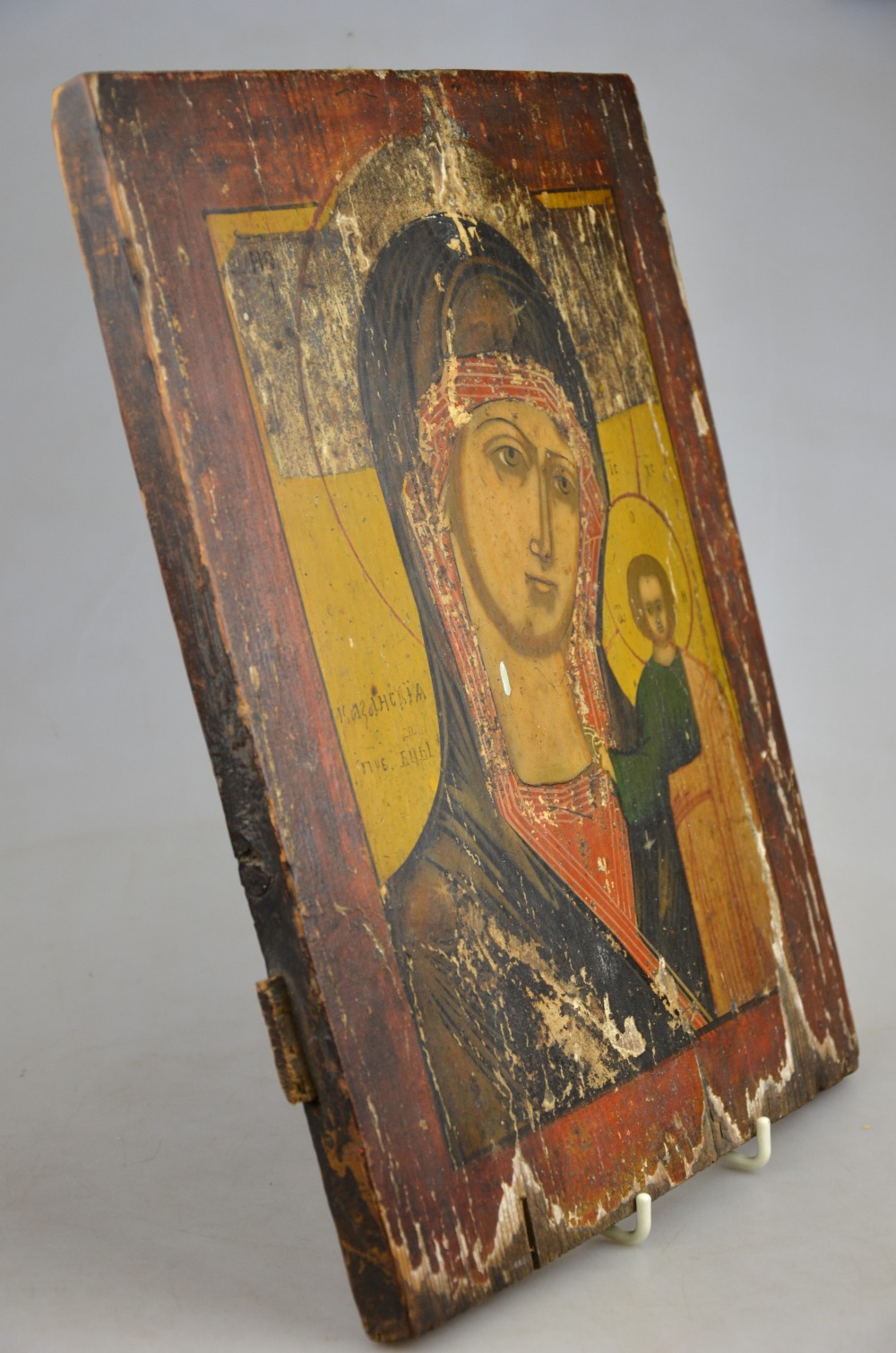 An antique Orthodox Icon (purchased in Russia), painted on a pine panel, depicting Madonna & Child,