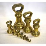 A matched graduated set of eleven brass bell-weights from 14lb to quarter ounce