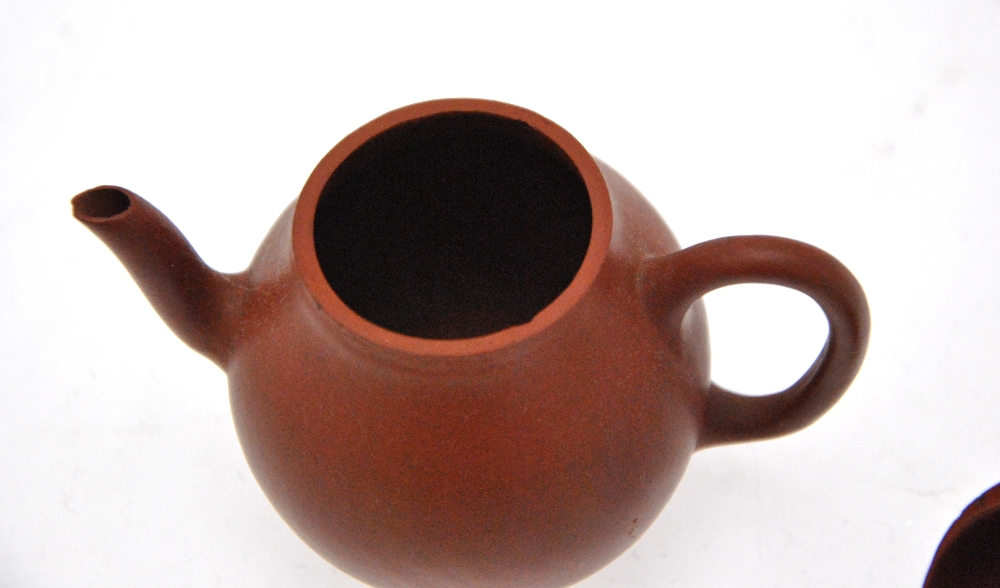 A Chinese miniature Yixing teapot, seal marks to the base, 6.5 cm h. Condition Report Chip to spout, - Image 4 of 5