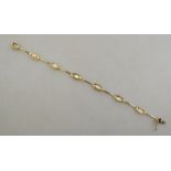 A 9ct yellow gold linked bracelet with mother-of-pearl insets to/w an amethyst and cubic zirconia