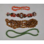 A carved bloodstone bracelet, stick coral bracelet,