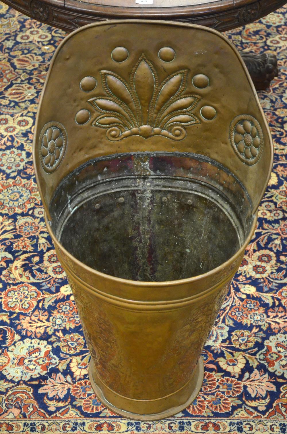 A grape-picker's copper hod with floral and foliate embossed top