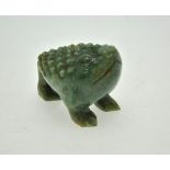 A Chinese green hardstone three legged toad, 8 cm h.