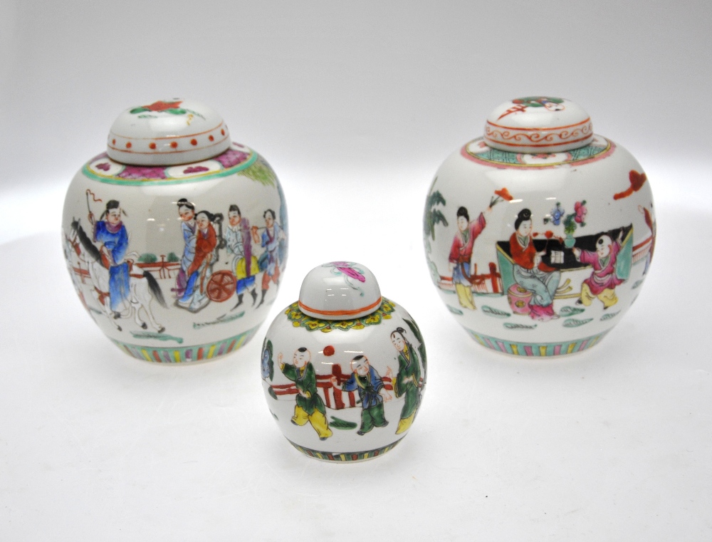 Three Chinese famille rose ovoid jars and covers, one decorated with a procession of figures, 19