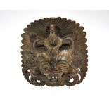 A Burmese carved hardwood mask in the form of a demon, approximately 21 cm h.