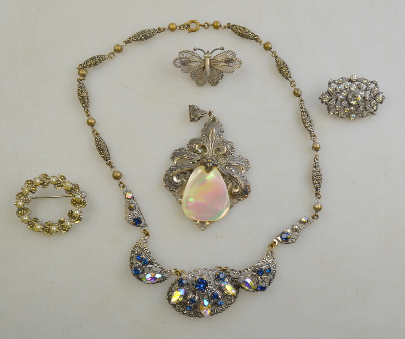 A collection of paste set items comprising pendant,