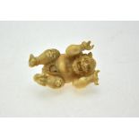 A Japanese carved ivory devil incorporating several animals, Meiji, 5.5 cm h. Condition Report Two