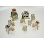 Seven porcelain crested ware bulldogs to/w a continental fairing 'Shamming Sick' and continental
