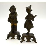 A pair of 19th century Continental bronze garniture figures and a boy clown and girl with doll,