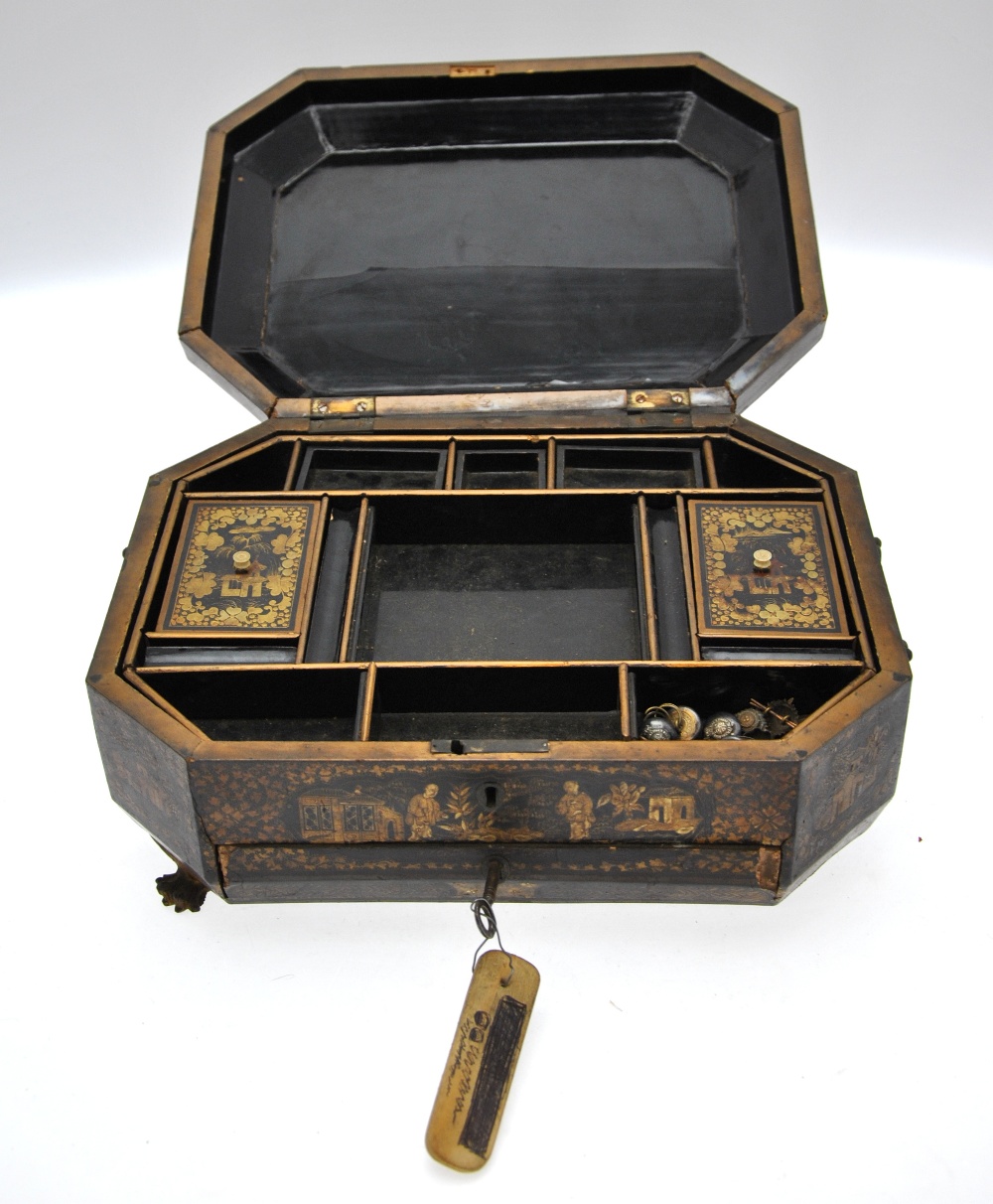 A Chinese 19th century black lacquer octagonal workbox, the hinged cover decorated in gilt with - Image 2 of 4