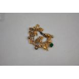 A 9ct yellow gold chain link bracelet with twenty-eight various charms attached, some white metal,
