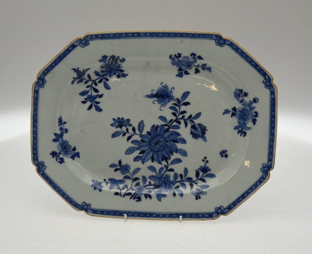 A Chinese 18th century blue and white chamfered rectangular meat plate decorated with flowers and