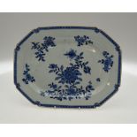A Chinese 18th century blue and white chamfered rectangular meat plate decorated with flowers and