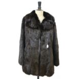 A dark brown coney fur jacket, size 12 Condition Report Lining torn