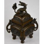 A Chinese 19th century bronze censer and cover of square form cast with panels of auspicious