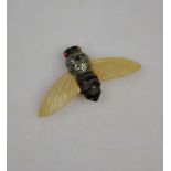 An Art Deco celluloid bee, formerly a brooch, wing span 7 cm Condition Report Fittings missing,
