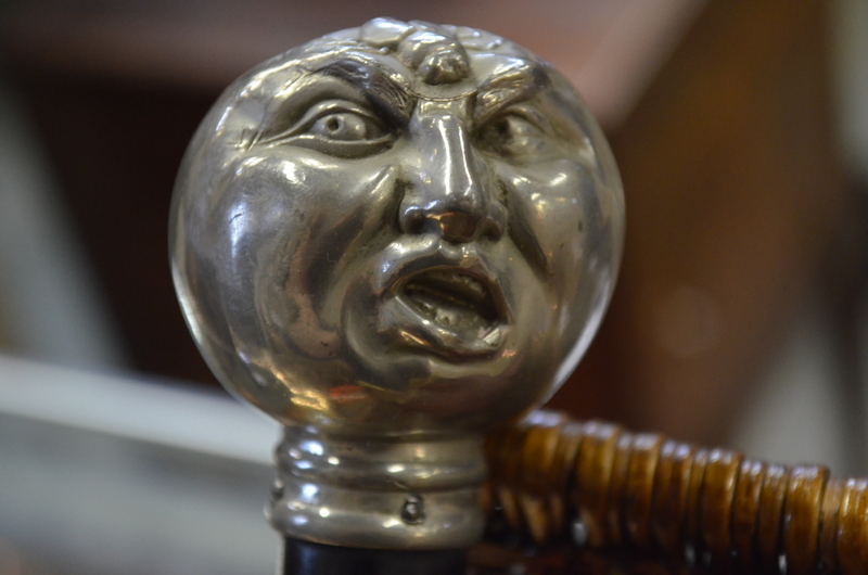 An ebonised page-turner, the electroplated pommel modelled as a man's head, - Image 2 of 4