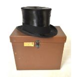 A black silk top hat, Herbert Johnson, 38 New Bond St., London, 55.5 cm circ., 20 cm front to