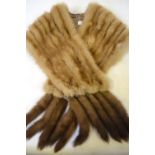 A shadowed blond mink stole embellished to ends to ten mink tails,