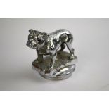 A chromium plated standing bulldog car mascot, mounted on a radiator-cap,