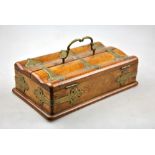 A Victorian brass mounted walnut pen/writing box with double hinged top enclosing three wells and a