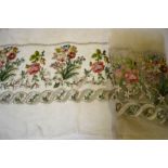 A 19th century cream silk pole screen panel embroidered with floral spray,