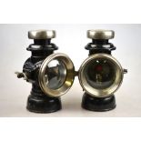 A pair of black bodied Lucas Kings Own car headlamps no F141,
