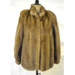 A taupe mink jacket with neru collar and two side pockets retailed by Emperor Fur Ltd., Kowloon,