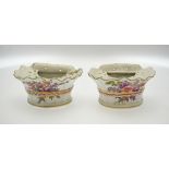 A pair of mid 18th century Chelsea porcelain fluted bough pots painted with floral sprays, 9 cm high