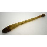 An Inuit Oosik baculum (walrus penis) - used as a club, 56 cm long Condition Report Charred at tip