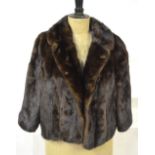 A dark brown mink, box-shaped, jacket retailed by J.
