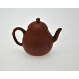 A Chinese miniature Yixing teapot, seal marks to the base, 6.5 cm h. Condition Report Chip to spout,