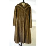 A full length smoky taupe mink coat retailed by Maxwell Croft, London & Bath, 54 cm across chest