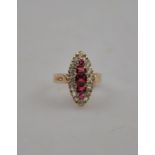 A marquise shaped red and white paste set cluster ring,