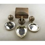 A silver cigarette box, London 1934, to/w a heart-shaped pin dish, a pair of Egyptian .