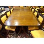 A Victorian mahogany triple pedestal dining table with a pair of wide insert leaves, raised on