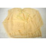 A collection of 1920's ladies' clothing comprising; a peach silk chiffon blouse with lace edged