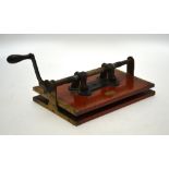A Downie's Patent antique brass-mounted book-press with folding crank handle,