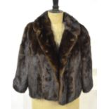 A dark brown mink, box-shaped, jacket retailed by J. Wiseman & Son, Chelsea, 54 cm across chest