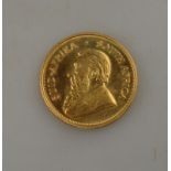 A gold Krugerand coin,