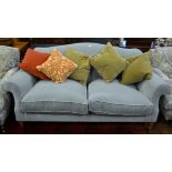 A traditional Howard stye sofa upholstered in mid-blue velveteen fabric complete with contrasting