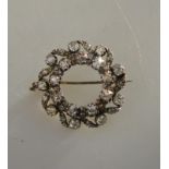 An antique diamond set double circlet brooch, old and eight-cut diamonds, silver set with gold