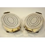 A pair of Victorian plated on copper hot-plates with pierced tops and twin handles, on bun feet,