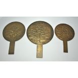 A graduated set of eight Japanese metal mirrors, early 20th century, 16.7 cm - 34.