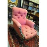 A Victorian button upholstered easy armchair with ebonised and parcel gilt frame,